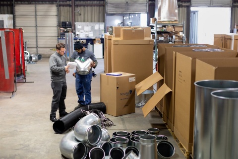 US Duct employees reviewing a ductwork order
